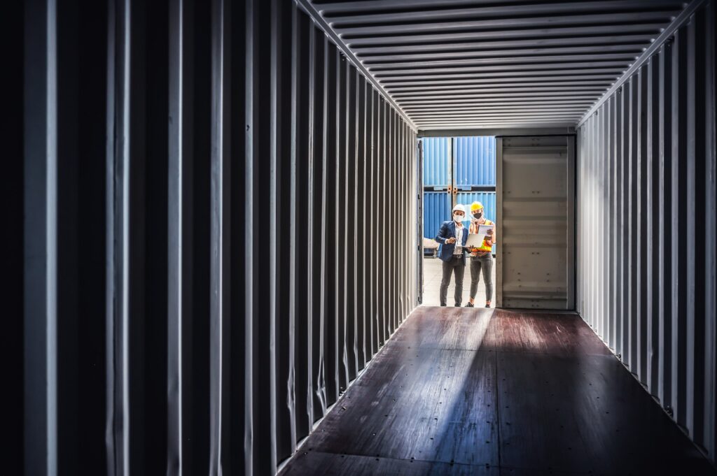 Engineers and supervisors are checking the quality of shipping containers