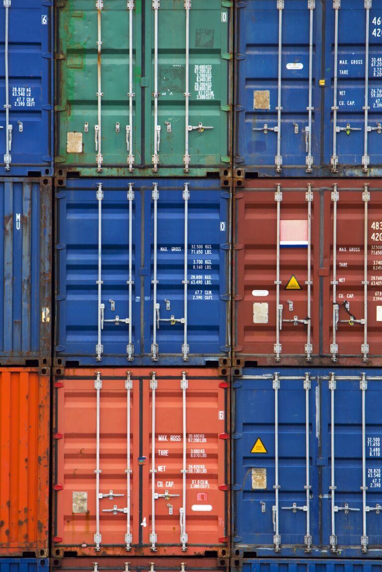 Four vertical rows of shipping containers
